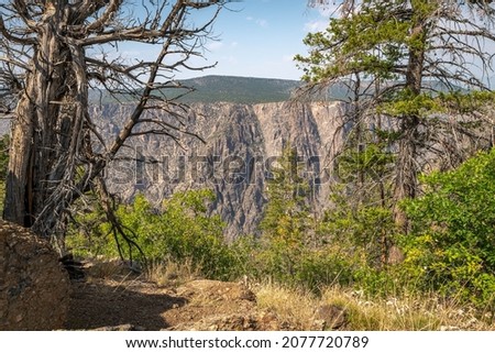 The north rim of the Black Canyon of the Gunnison, from a trail on the south side of the park Royalty-Free Stock Photo #2077720789