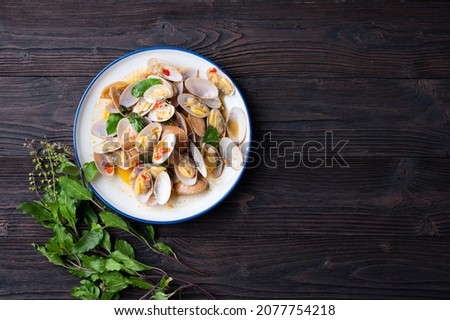 Stir fried Spicy Clam (Surf , Short necked , Carpet , Venus shell, Baby clam) with Thai Holy Basil With  Steamed Rice , Asian Food Royalty-Free Stock Photo #2077754218
