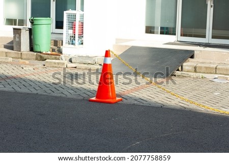 Orange cones are usually used for borders or caution symbols, suitable for commercial or editorial use