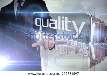 Businessman presenting the word quality against room with large window looking on city