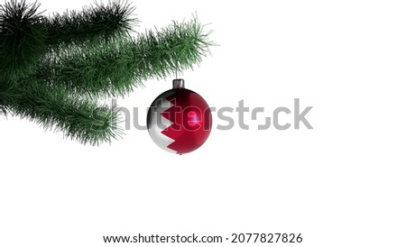 New Year's ball with the flag of Bahrain on a Christmas tree branch isolated on white background. Christmas and New Year concept.