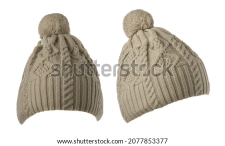 two light gray hats with pompon . knitted hats isolated on white background.