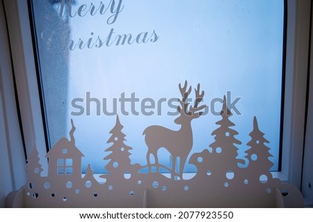 Christmas window decoration. Vintage Christmas background with Christmas decoration against winter window 