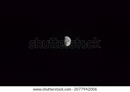 
Half moon in the dark night