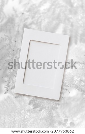 photo frame mockup, christmas white leaves background