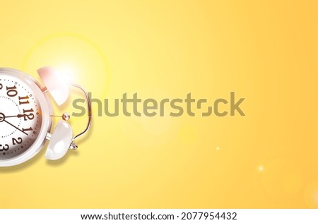Old alarm clock on color background. Autumn month, day of the year concept