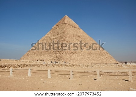 Pyramid of Khafre (lso read as Khafra, Khefren) or of Chephren is the second-tallest and second-largest of the Ancient Egyptian Pyramids of Giza and the tomb of the Fourth-Dynasty pharaoh Khafre  Royalty-Free Stock Photo #2077973452