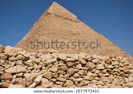 Pyramid of Khafre (lso read as Khafra, Khefren) or of Chephren is the second-tallest and second-largest of the Ancient Egyptian Pyramids of Giza and the tomb of the Fourth-Dynasty pharaoh Khafre  Royalty-Free Stock Photo #2077973455