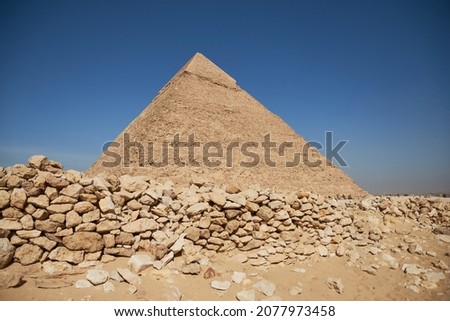 Pyramid of Khafre (lso read as Khafra, Khefren) or of Chephren is the second-tallest and second-largest of the Ancient Egyptian Pyramids of Giza and the tomb of the Fourth-Dynasty pharaoh Khafre  Royalty-Free Stock Photo #2077973458
