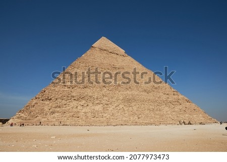 Pyramid of Khafre (lso read as Khafra, Khefren) or of Chephren is the second-tallest and second-largest of the Ancient Egyptian Pyramids of Giza and the tomb of the Fourth-Dynasty pharaoh Khafre  Royalty-Free Stock Photo #2077973473