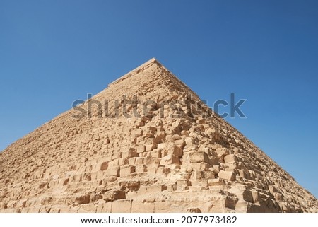 Pyramid of Khafre (lso read as Khafra, Khefren) or of Chephren is the second-tallest and second-largest of the Ancient Egyptian Pyramids of Giza and the tomb of the Fourth-Dynasty pharaoh Khafre  Royalty-Free Stock Photo #2077973482