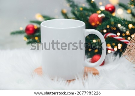 Christmas mock up with white blank coffee mug perfect for your own design or quote. Mockup festive Christmas concept.