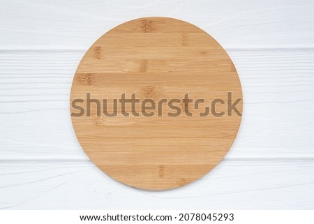 Blank round wood sign with copy space lies on white background. Simple Mockup farmhouse circle sign.