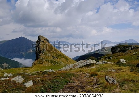 Beautiful mountain view above clouds during hiking on peak Djeravica (Gjerovica) - the highest peak of Kosovo. Albanian Alps, Peaks of Balkans Royalty-Free Stock Photo #2078054938