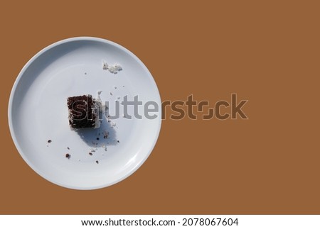 south indian breakfast food ragi puttu in circle shape white plate with brown background.copy space