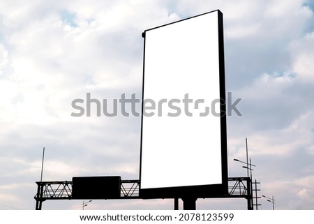 vertical billboard against the background of the cloudy sky. mockup, place for your information or advestering Royalty-Free Stock Photo #2078123599