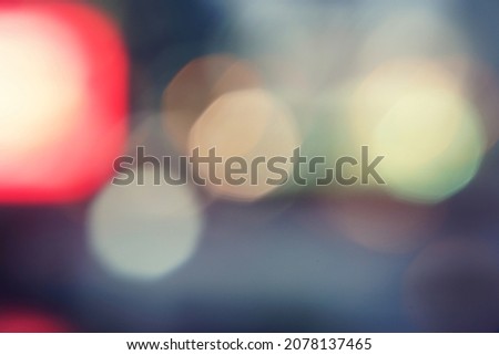 Abstract background with blurred colorful bokeh defocused lights represent entertainment content, season’s greetings, holiday celebrations theme. (space for text design)