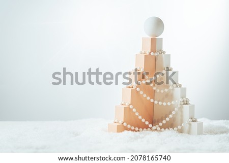 Christmas tree made of geometric shapes and podiums on white background