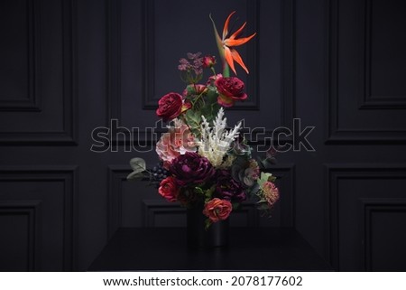 Plastic handmade bouquet artificial flowers composition.Beautiful flowers in vase on a table with black  background. Women's, mother's day. Spring, summer season. Front view.Selective focus.
 Royalty-Free Stock Photo #2078177602