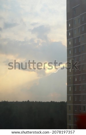 red brick building. Sky and city, fragment blur