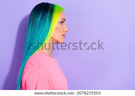 Profile side photo of millennial blue teal different color haired lady look empty space isolated over violet color background