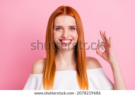 Photo of pretty happy nice woman make okay sign smile promoter approve isolated on pink color background