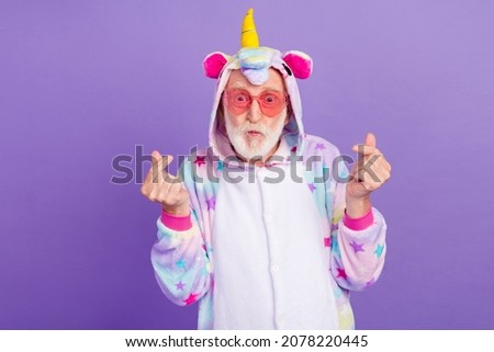 Photo of flirty funky retired man nightwear overall hands dark eyewear sending kiss showing heart sign isolated purple color background