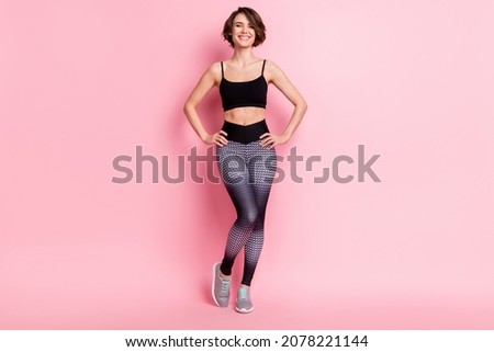 Full length photo of pretty nice young woman smile good mood fit hold hands waist isolated on pink color background Royalty-Free Stock Photo #2078221144