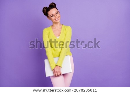 Photo portrait of woman in glasses keeping computer smiling in casual clothes in spectacles isolated on pastel purple color background