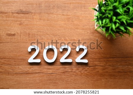 2022 text with Concept Start New Year 2022 on the business desk