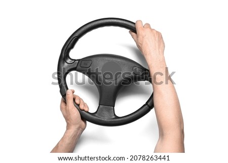 Male hands and steering wheel on white background Royalty-Free Stock Photo #2078263441