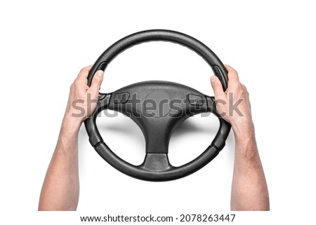 Man holding steering wheel on white background Royalty-Free Stock Photo #2078263447