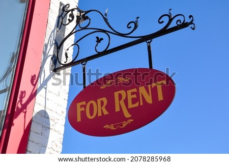 For rent sign hanging outside the building