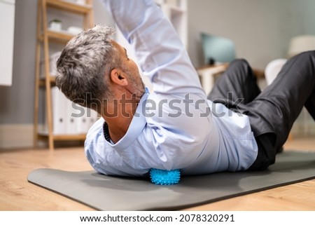 Back Trigger Point Massage Using Spiky Ball Myofascial Release Royalty-Free Stock Photo #2078320291