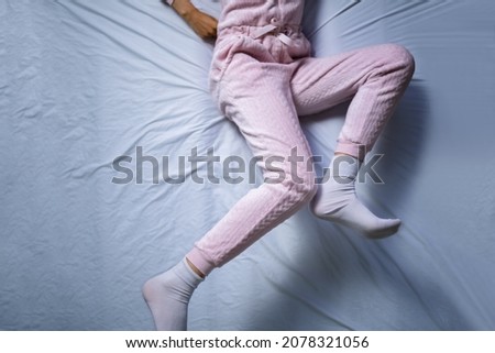 African American Woman With RLS - Restless Legs Syndrome. Sleeping In Bed Royalty-Free Stock Photo #2078321056