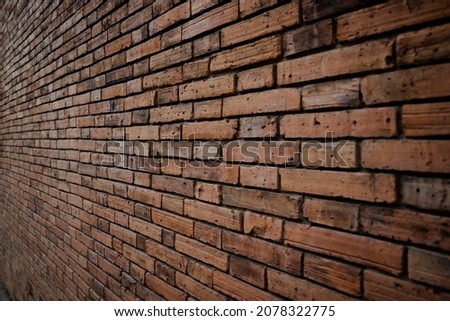 Old red brick wall background, Side-focus shot in the center of the frame