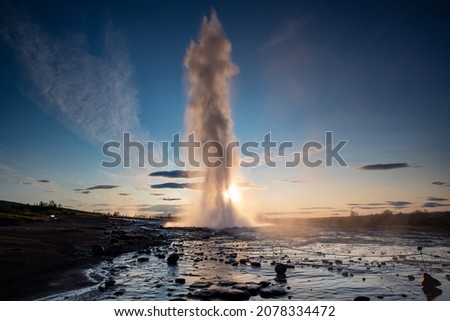 A landscape view of erupting of Strokkur Geysir geyser in southwestern Iceland, Europe  Royalty-Free Stock Photo #2078334472