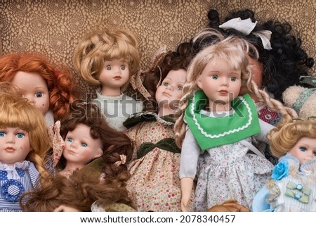 Old dolls placed in suitcase  Antique toy, vintage dolls  Handmade  Royalty-Free Stock Photo #2078340457