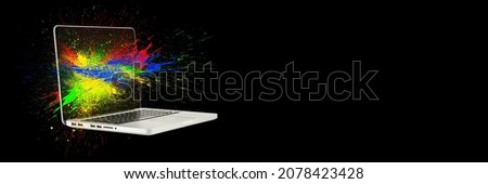 Calibration of laptop screen, monitor color, tablet or laptop. Modern laptop isolated on black with green screen. Multi-colored spray splashes in all directions.