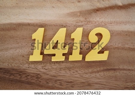 Golden Arabic numerals 1412 on a dark brown to white wood grain background.