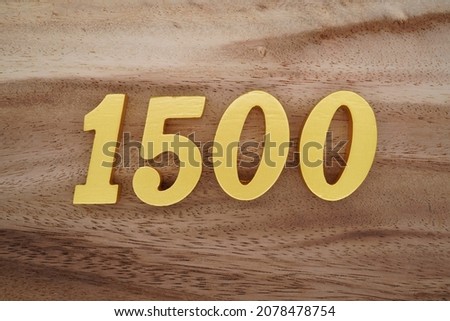 Golden Arabic numerals 1500 on a dark brown to white wood grain background.