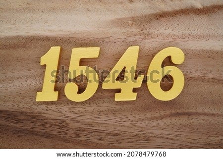 Golden Arabic numerals 1546 on a dark brown to white wood grain background.