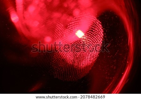 Beautiful abstract RED colored  fingerprint on background texture for design. Macro photography view.