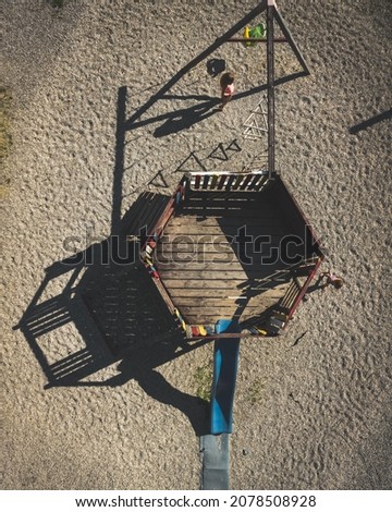An aerial shot of an old wooden kids playground