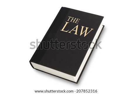 Black book with the words The Law title on front. Isolated on white with path