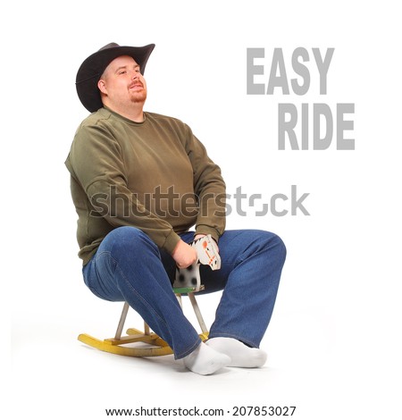 Overweight cowboy riding on a rocking horse. Picture with space for your text.
