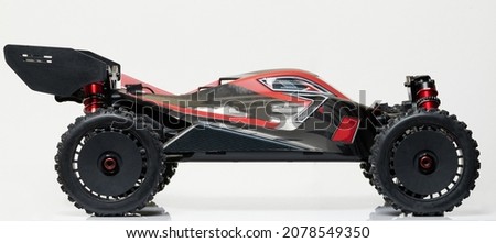 Profile view of buggy rc car isolated on studio background Royalty-Free Stock Photo #2078549350
