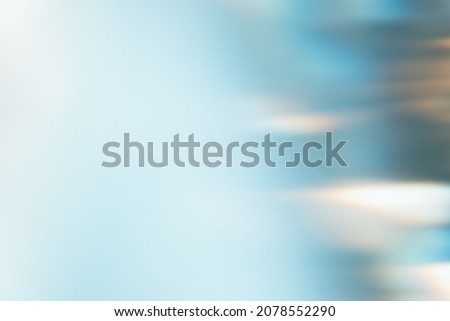 Light flare filter. Blur glow overlay. Sunlight reflection. Bokeh radiance. Defocused blue white orange color gradient texture abstract background.