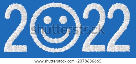 New Year2022. Clouds in shape of the letter 2022 isolated on blue. Zero in the form of a smile. High resolution photo.