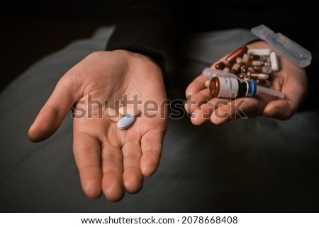 Cystic fibrosis patient holding life-saving treatment drug in hand. Targeted gene corrector therapy to stimulate immune system. Mucoviscidosis clinical trial. Combination drug to replace antibiotics. Royalty-Free Stock Photo #2078668408